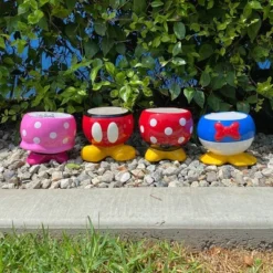 Disney 7" Wide Mickey Mouse Ceramic Indoor Outdoor Planter Pot Multicolor -Home Improvement Store GUEST 1bbe5fa3 3f4f 4135 9c9b fb011c2b4ba3